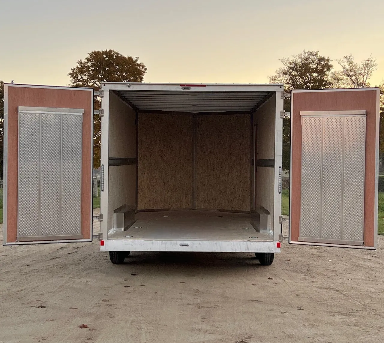 Inside an enclosed trailer, open barn doors